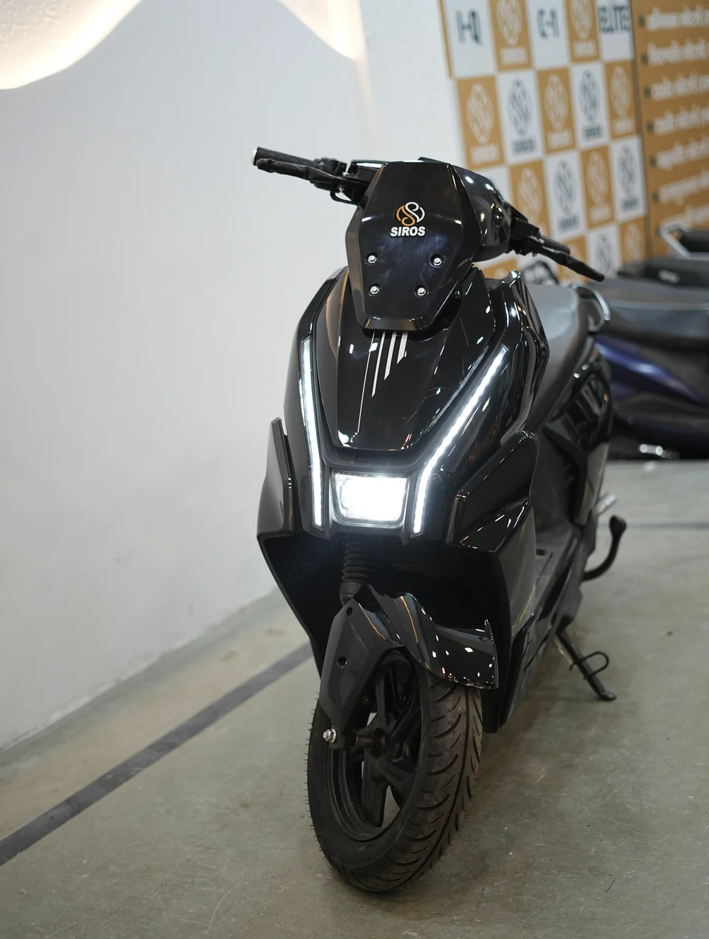 A dark-colourway SIROS electric scooter
